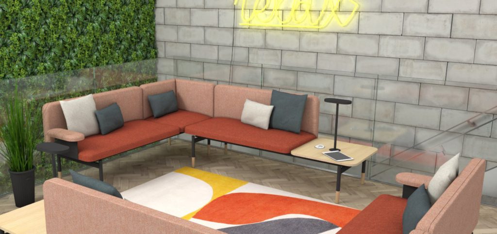 Office reception breakout space, with L-shaped corner sofa upholstered in red fabric